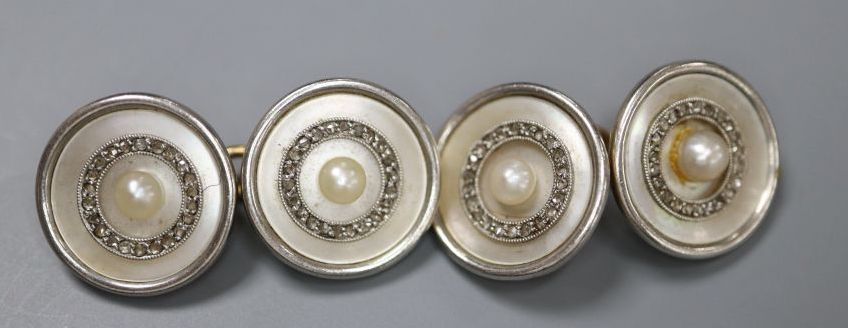 A pair of early to mid 20th century yellow metal (stamped 18), mother of pearl, seed pearl and diamond set cufflinks,